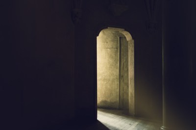 Mystic Gothic Door with Sunlight Entering Dark Room, Exit to Light, Hope and New Beginning Concept, Vintage Retro Tone Effect